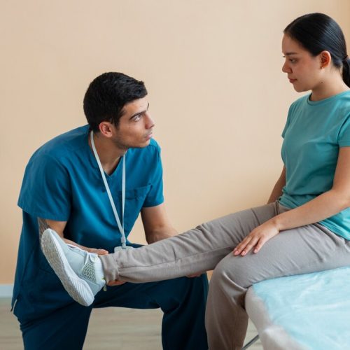doctor-helping-patient-rehabilitation_23-2150321630