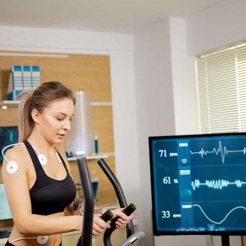 female-athlete-who-makes-physical-effort-stepper-has-electrodes-attached-it-results-are-seen-screen-sports-laboratory_482257-31678