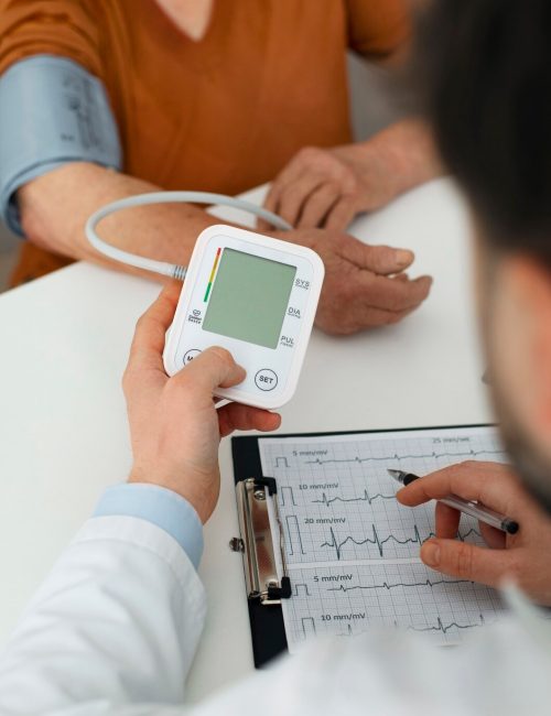 older-person-checking-their-blood-pressure-with-tensiometer_23-2150456131