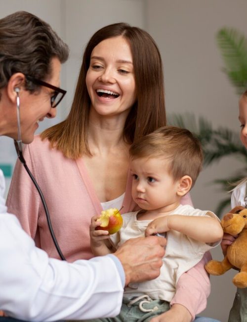 young-mother-with-her-children-pediatrician-appointment_23-2149187458